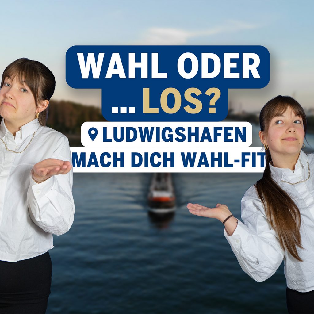 Ellie steht links und rechts im Bild und zeigen mit offenen Händen eine fragende Geste. In der Mitte befindet sich der Schriftzug „Wahl oder … los? Mach dich wahl-fit“. Im Hintergrund ist ein Blick über den Rhein bei Ludwigshafen, in der Mitte des Flusses fährt ein Schiff.